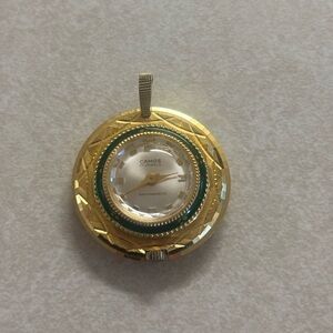 Camos Gold-Tone Round Pendant Watch with Green Accent